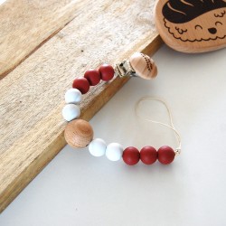 Attache tétine pour bébé coloris rouge brique